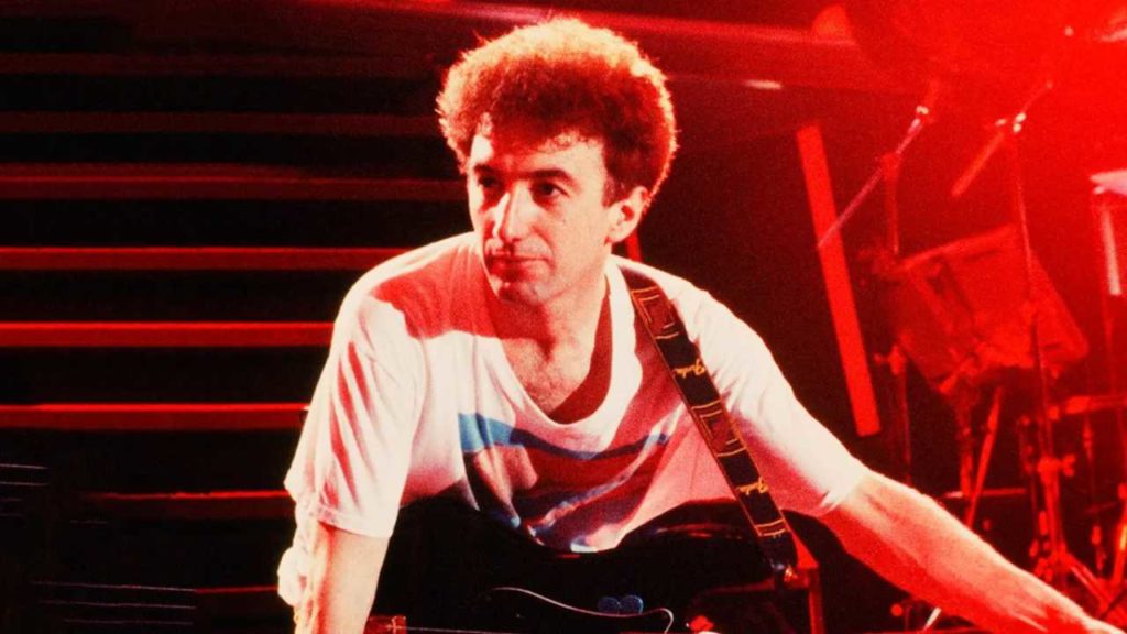 El guitarrista de Queen aclara el papel de John Deacon a pesar de su retiro.